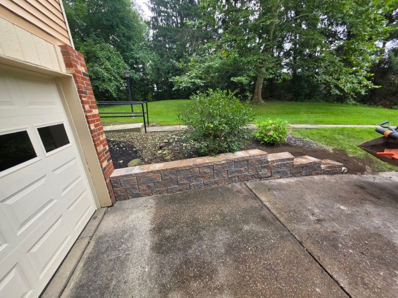 Herringbone clay brick paver patio built by the Grass Commander crew